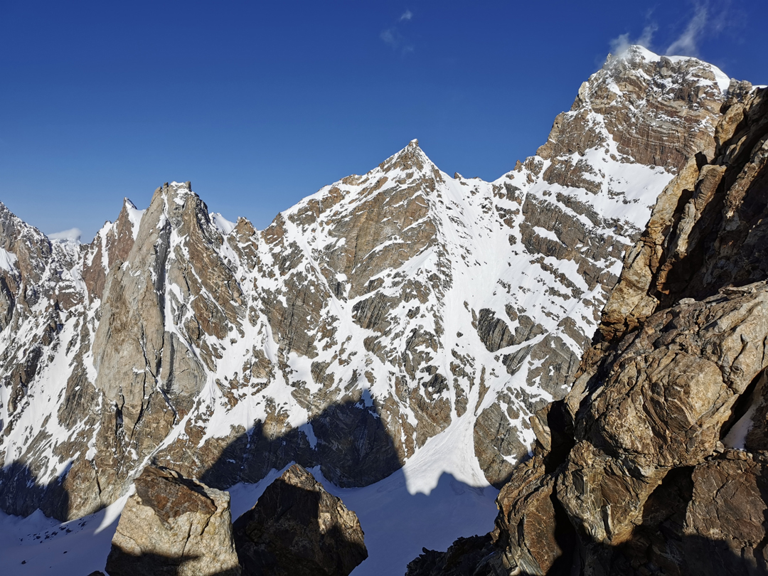 Looking west-southwest from the col between Chanrasrik Ri and a small unclimbed peak on the watershed ridge to the west. (A map in AAJ 2018 marks two peaks between Chanrasrik Ri and Vajrayogini, but there is only one.)  The high peak on the right is Vajrayogini; the unclimbed spires to the left lie on its southeast ridge, above the Satachan Tokpo (a side valley of the Haptal Tokpo).  