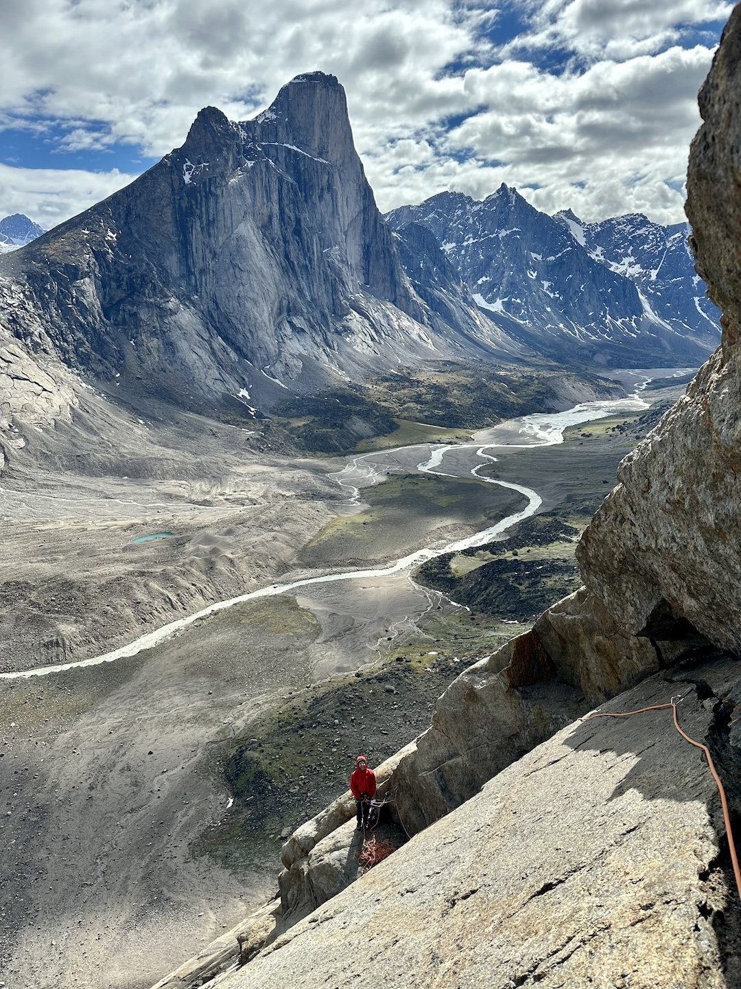 Looking down pitch eight of PangTen (424m, 5.10) with the 1,250-meter west face of Mt. Thor in the background. 