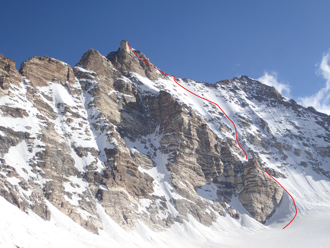 The south face of Skarma Mindruk Ri (T16, 6,431m), above the upper Khapang Glacier, and the final section of the 2024 route Šentjurka, as seen from Col 5,836m. 
