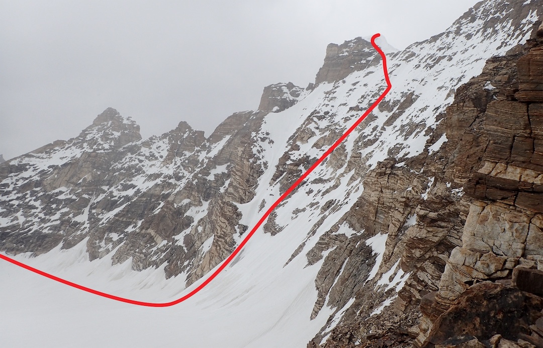 Approximate line of the route Šentjurska on the south face of Skarma Mindruk Ri (T16), as seen from a 6,039m col east-southeast of the mountain. T16 South, climbed in 2016, is the sharp peak to the far left.
