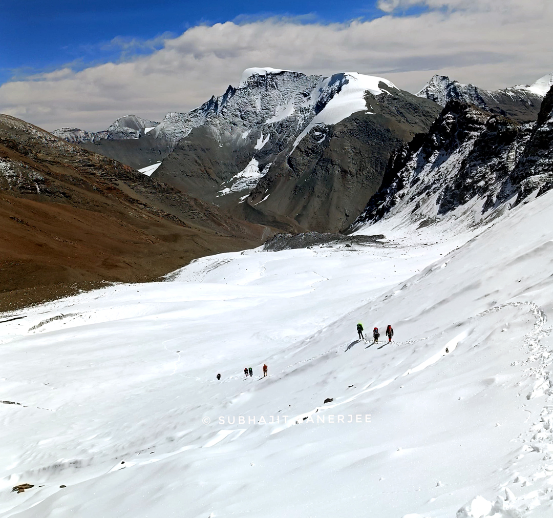 Approaching the foot of the east face of Shingo South, looking east-southeast at Shingo East (6,080m).  