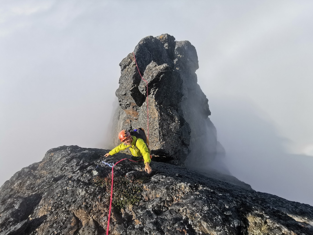 Ben Kent finishing the initial 135m simul-climbing pitch of Encore (332m climbing distance, E4 6a), Innaarsuit, Kekertarmiut Island, Greenland. 