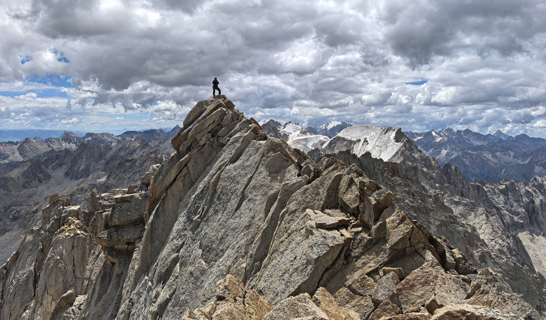 On top of Peak 5,538m in the southeast Zhuqing Range. The ice-covered peak behind and to the right is Peak 5,590m (measured at 5,529m).