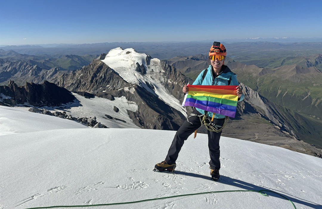 Xueer Yu on the summit of Gangga I. Behind is Gangga II (5,582m).