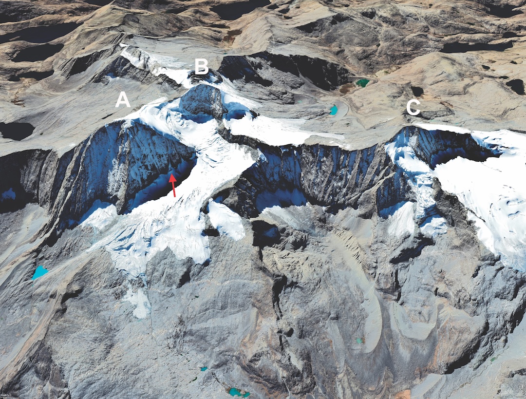 The north sides of (A) Pico Cristóbal Colón (5,713m), (B) Pico Simón Bolívar (5,720m), and (C) Pico Simmonds (5,594m). The arrow marks the start of the 2023 route on Pico Colón. Access to this area is by a pass on the north side of Pico Simmonds, in the lower right corner of this map.