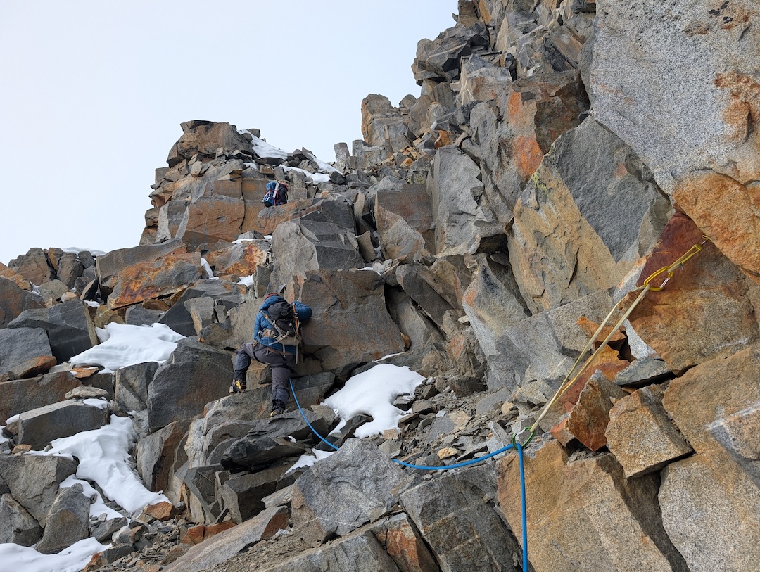 Ginge Fullen and Jonathan Suarez climbing a rock pitch on the south side of the east ridge of Pico Simón Bolívar. 