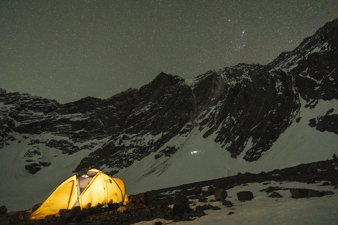 Nicolás Gutiérrez, Alexis Rojas, and Cristóbal Cament approaching the south face of Cerro Tronco from base camp. 
