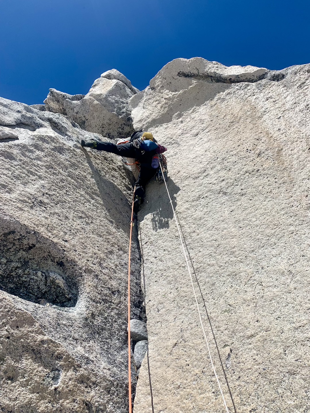 Flavie Cardinal climbing a steep tight-hands dihedral on the headwall of Pirita Central. 
