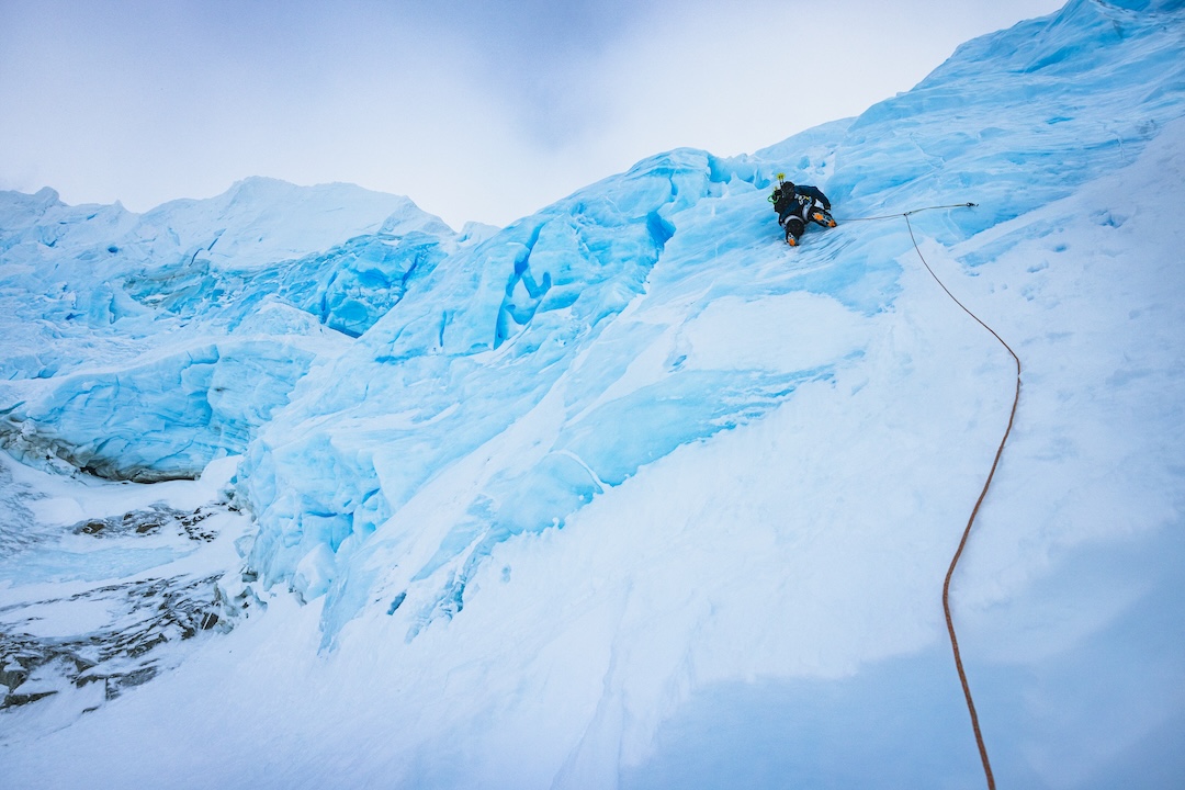 Thor Retzlaff leads the glacial ice headwall guarding access to the Cerro Ambrosio Oeste's upper ramps and arête. Thor led the pitch on a Petzl 6mm rad line and two ice screws.