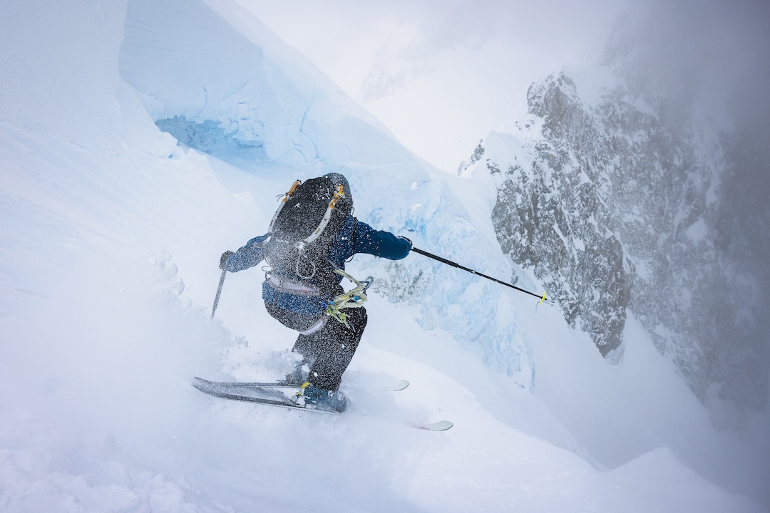 Thor Retzlaff launches into a glorious pitch of deep powder steep skiing on an exposed ramp between two serac bands on Cerro Ambrosio Oeste. 