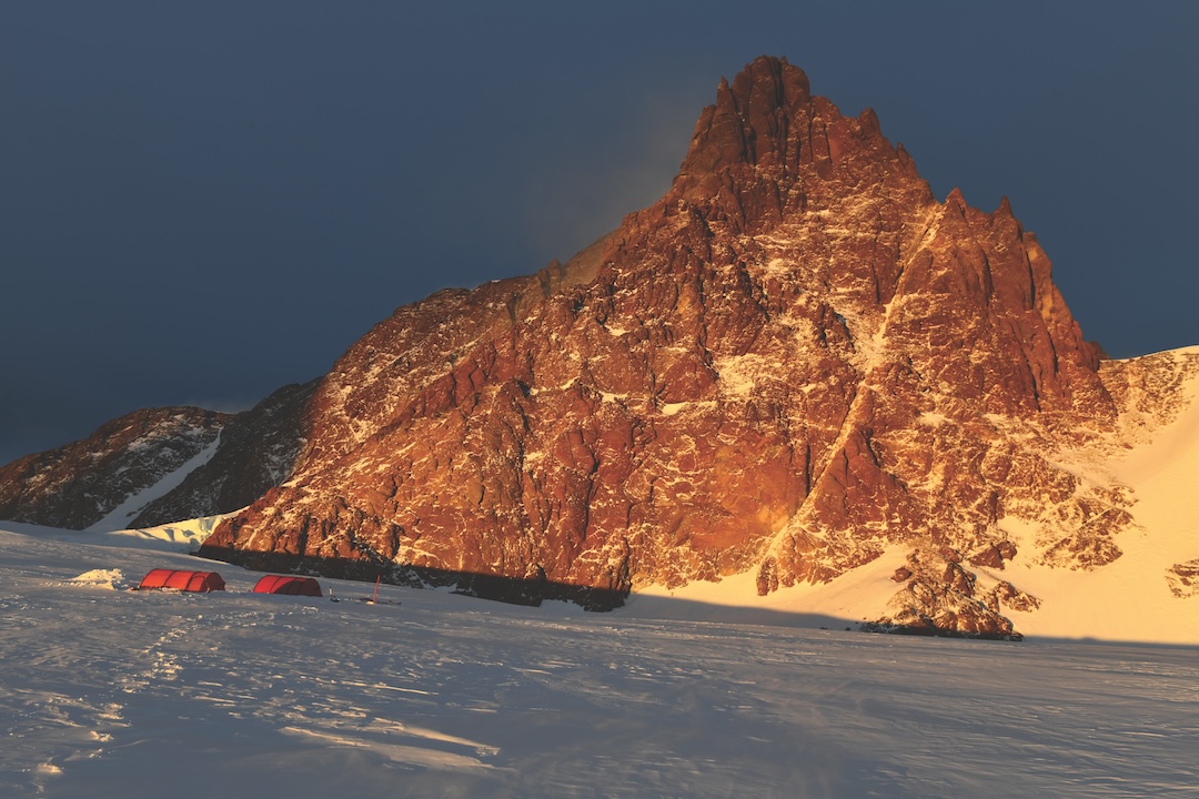 The south face of the Bergfuhrerspitz (2,325m) in the midnight sun. The first ascent route of Robert Miller and Tom Rabl on November 11, 2024, ascended the left glacier and ran behind the western rocky ridge. The second ascent route, by Christoph Höbenreich and Tom Rabl on November 17, followed the ice slope to the right and then ran back left behind the obvious rock ridge. Both routes reach the summit from behind.
