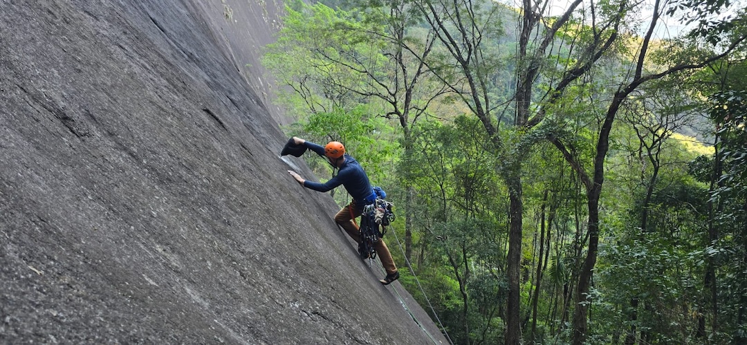 Ed Padilha begins the first pitch of a new route on Pedra do Cabrito. 