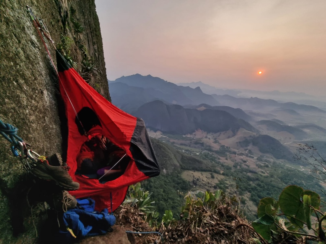 A beautiful sunrise and the team portaledge during the ascent of a new 910m route on the southeast face of Pedra do Cabrito. 