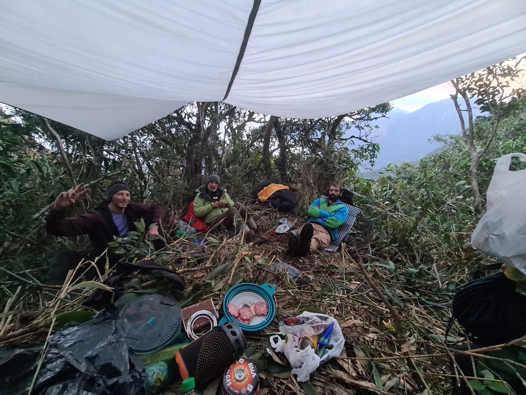 Bivouacking on an overgrown plateau during the first ascent of Pico do Paraná’s south face, via the route Submundo das Sombras (655m of climbing, 7a A2). 