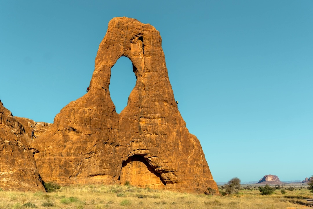 Sam Stuckey goes ground-up (left) on a 5.9 R in the Ennedi Massif, Chad, while Natalie Afonina follows Dakota Walz (right) on another 5.9. 