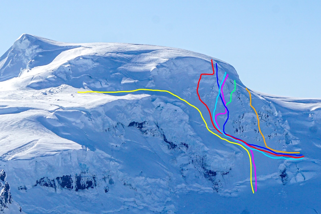 The routes on the northwest face of Hvannadalshnúkur: Helgi Benediktson Route (yellow, 1986 solo first ascent), Póker ásanna (red line, 2024), Katabatic (light blue, 2023), Hnúkaþeir (dark blue, 2020), Beina brautin (pink, 2010), Vinamissir (green, 2016), and Italian Job (orange, 2014) 