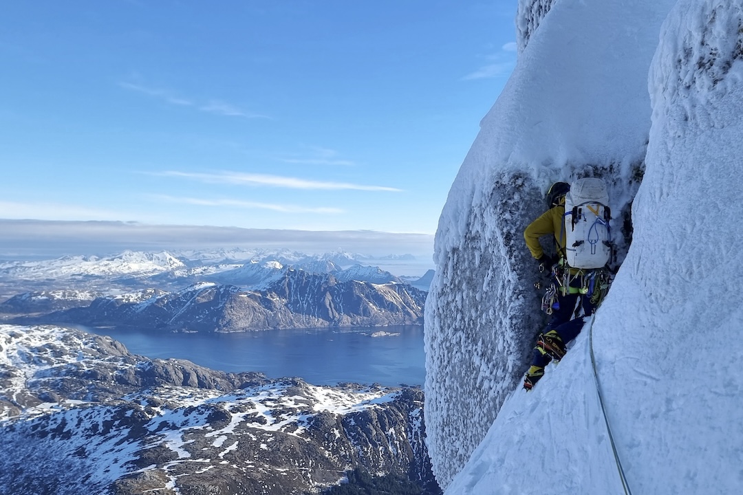 Chris Wright starting a pitch high on the northeast face of Stjerntinden.