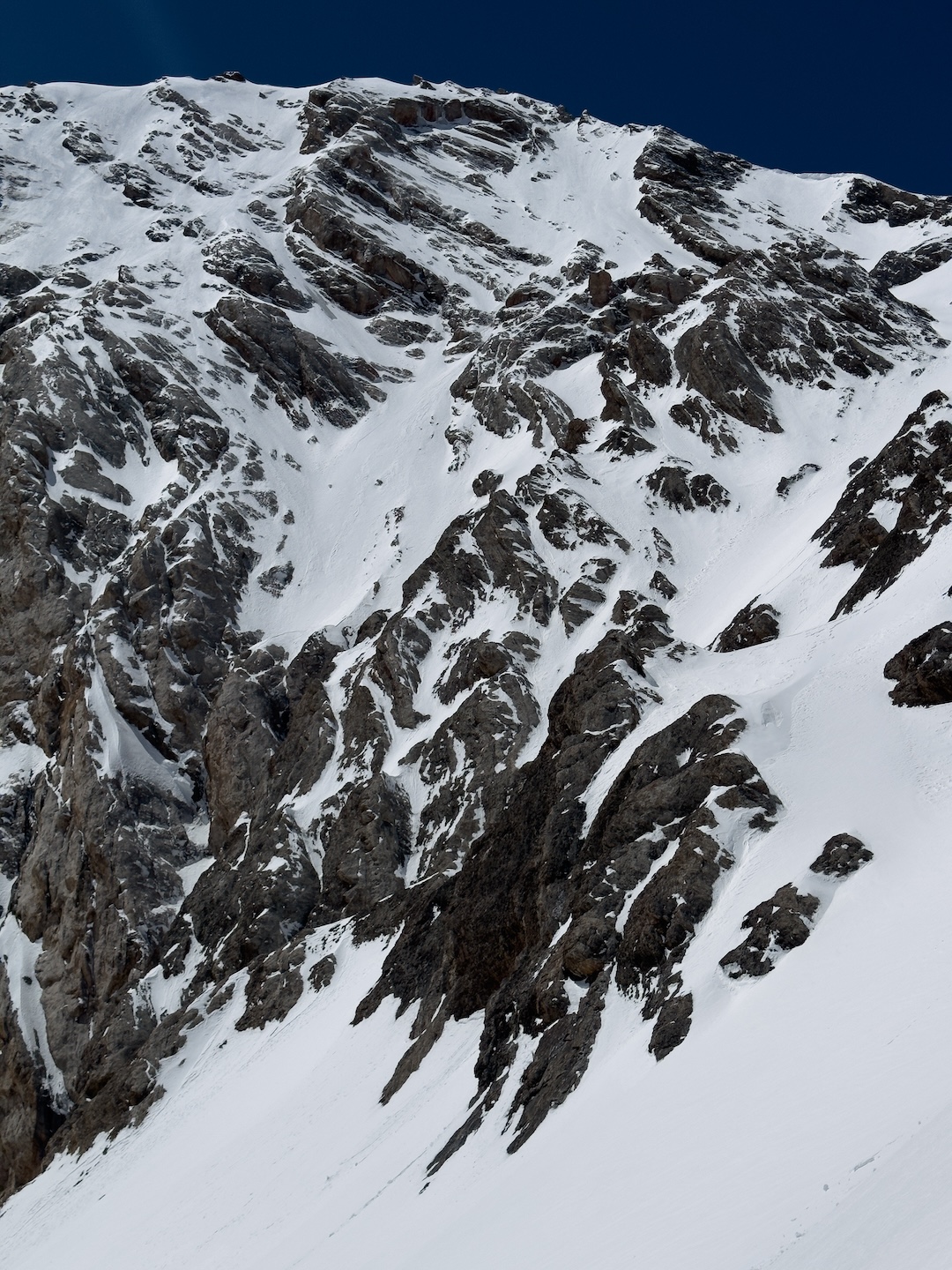 Foreshortened view from below of the complex northeast face of Energia Peak (5,120m). The summit is in upper left.