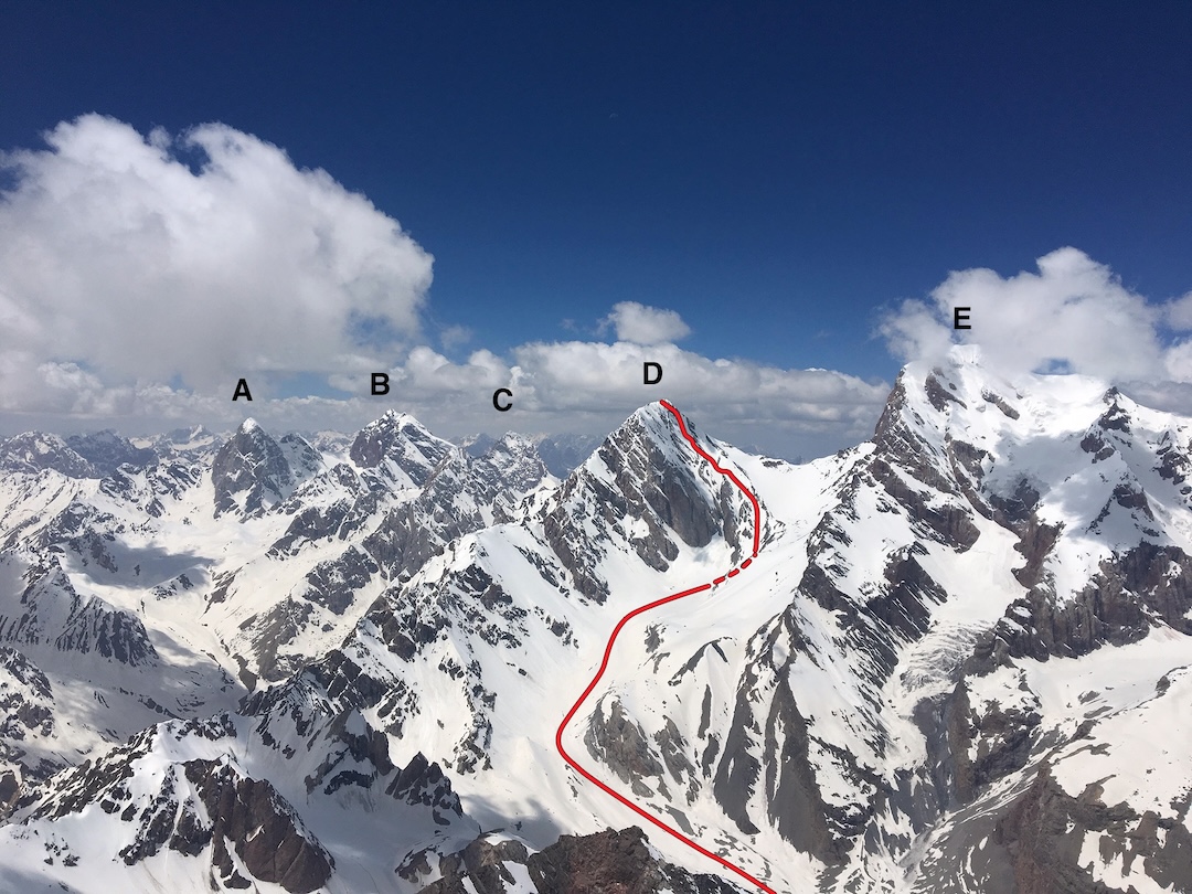 View to the southwest showing (A) Sakharnaya Golova, (B) Moscow Peak, (C) Skal’naya Stena, (D) Energia Peak (5,120m) with the 2024 ski route down the northeast face, and (E) Chimtarga.