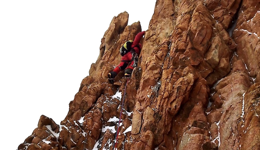 Egor Matveenko leads below the main tower of Dvurogaya Peak (4,814 meters) on the Ak-sai Horseshoe traverse. Starting up from the shoulder between Kosmonavtov Peak and Dvurogaya.

