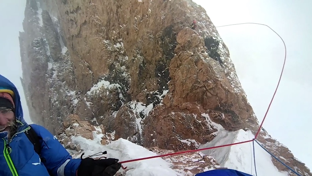 The saddle between Dvurogaya and Korona’s sixth tower. Tikhon von Stackelberg belays as Egor Matveenko climbs through harsh wind.
