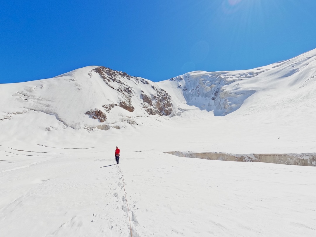 Line Peak on the left (east) side of the cirque at the head of the western arm of the Djangartynbashi Glacier. The climbers ascended the ice face in the center.