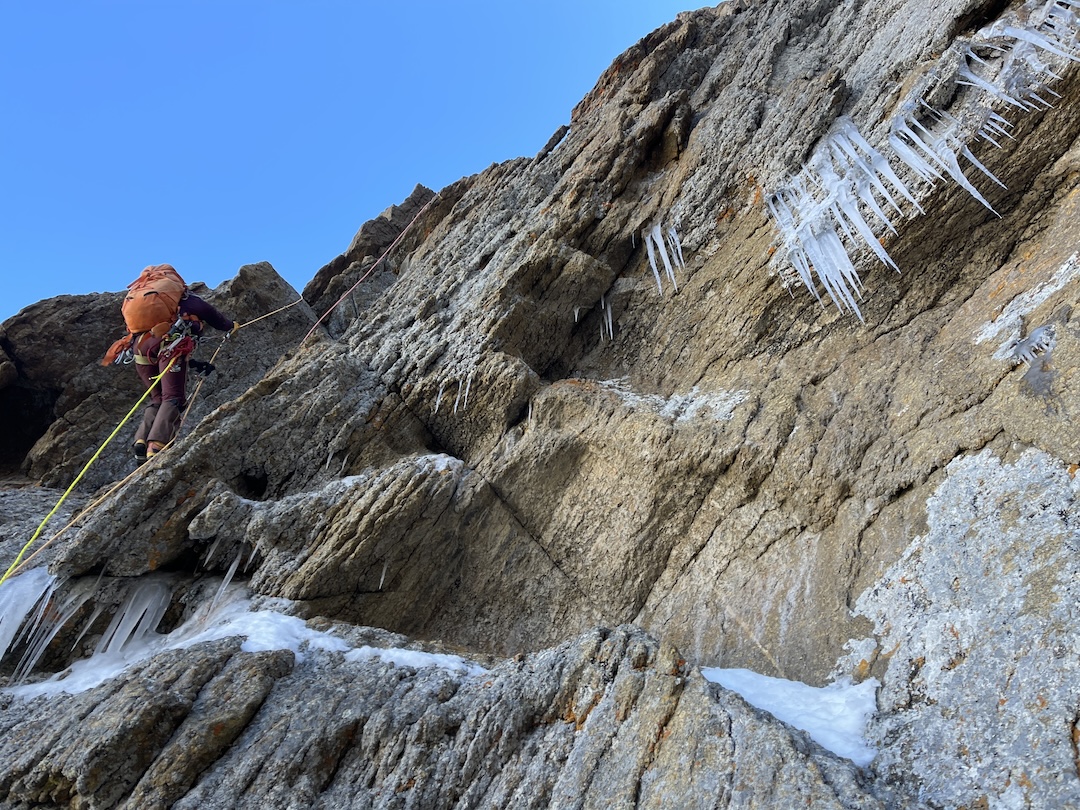 Olga Lukashenko moving up on the southwest face of Parus West. Summer storms had left the rock much icier than expected.