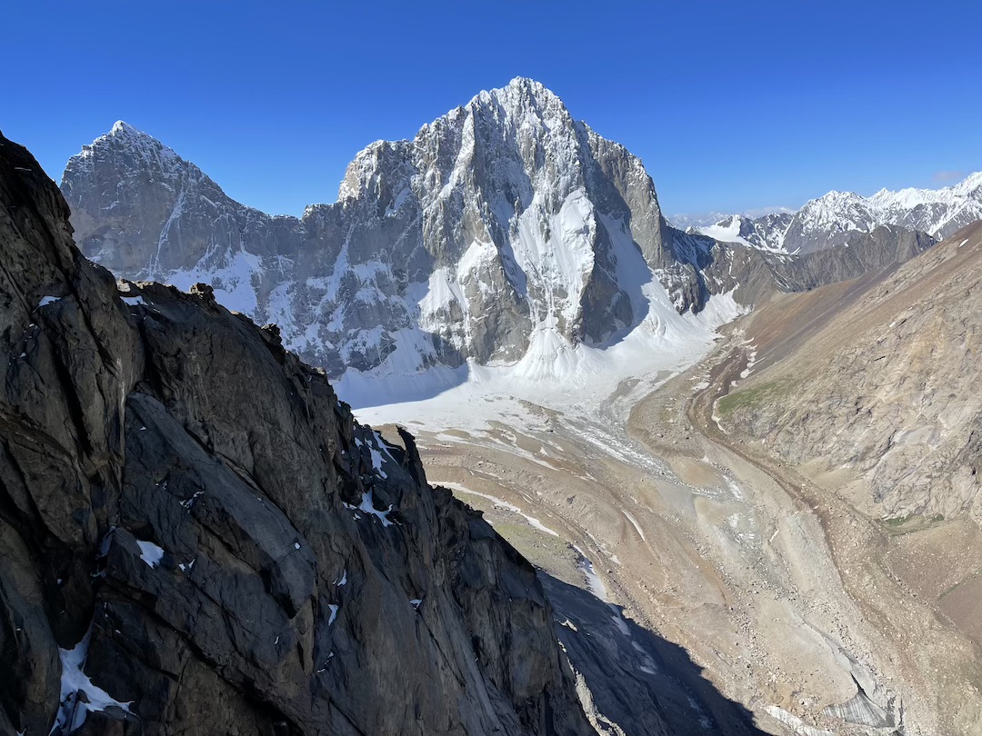 A view from the southwest face of Parus West to the head of the Ashat Gorge, with a partial view of the north face of Argo on the left and the north face of Sabakh on the right.