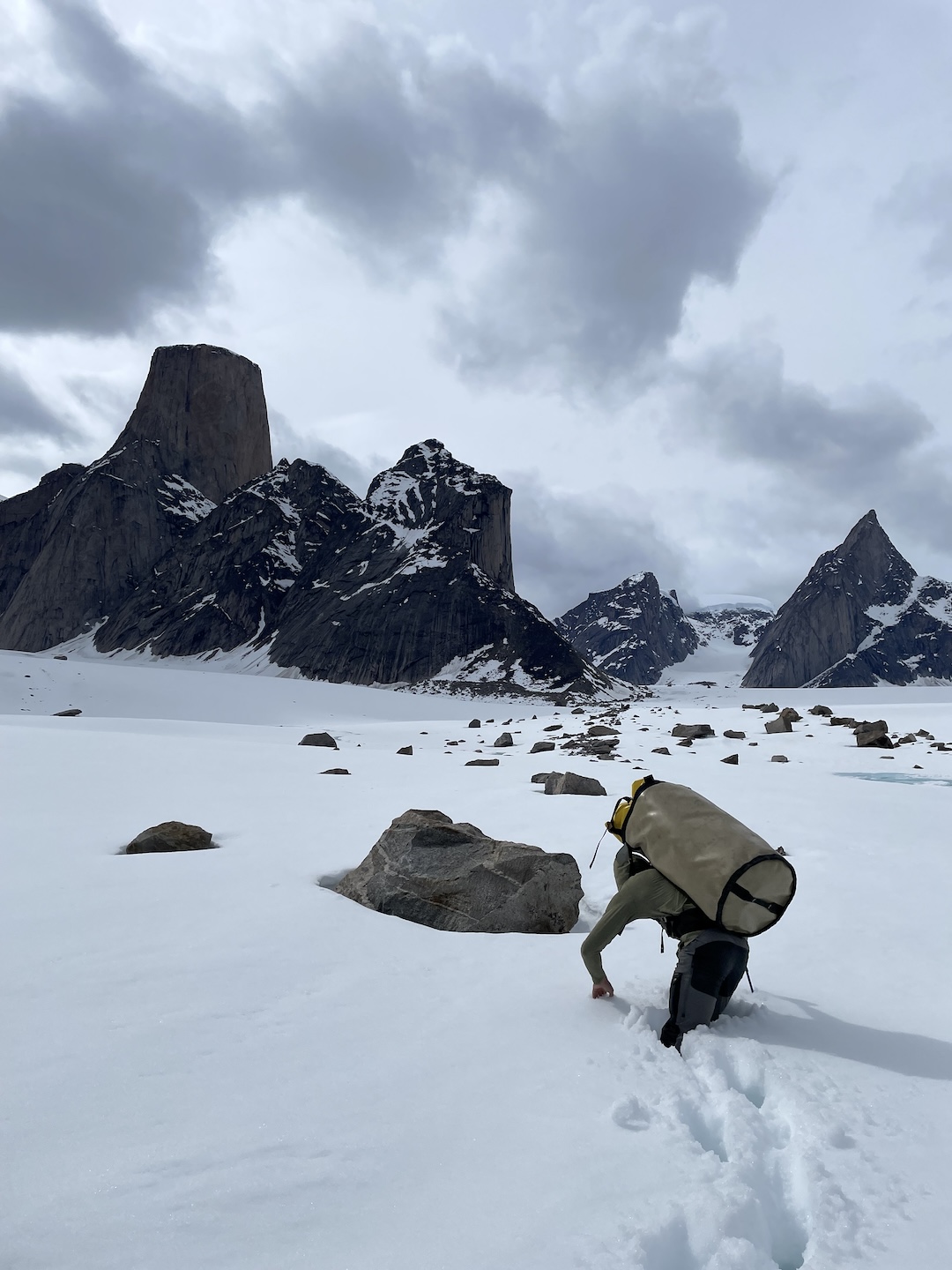 Brandon Adams plows the trail to base camp on the Turner Glacier. Traveling light, by Baffin standards, the team brought no shovels and had to dig out their tent site with food buckets.