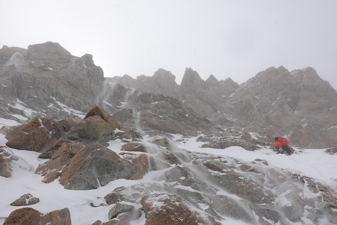 Aleš Česen navigates rocky steps and spindrift on the third climbing day on Gasherbrum III.
