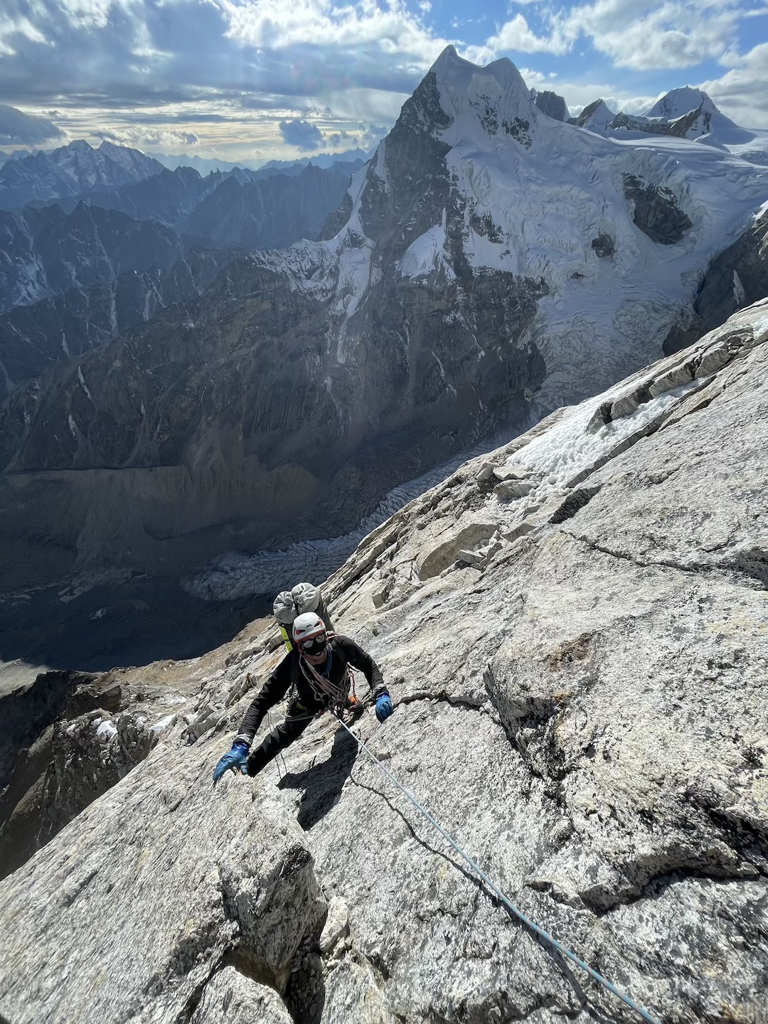 Ryan Griffiths at about 6,000 meters on Kaqur Kangri, with unnamed and unclimbed Peak 6,226m (6,145m on some maps) in back to the west.