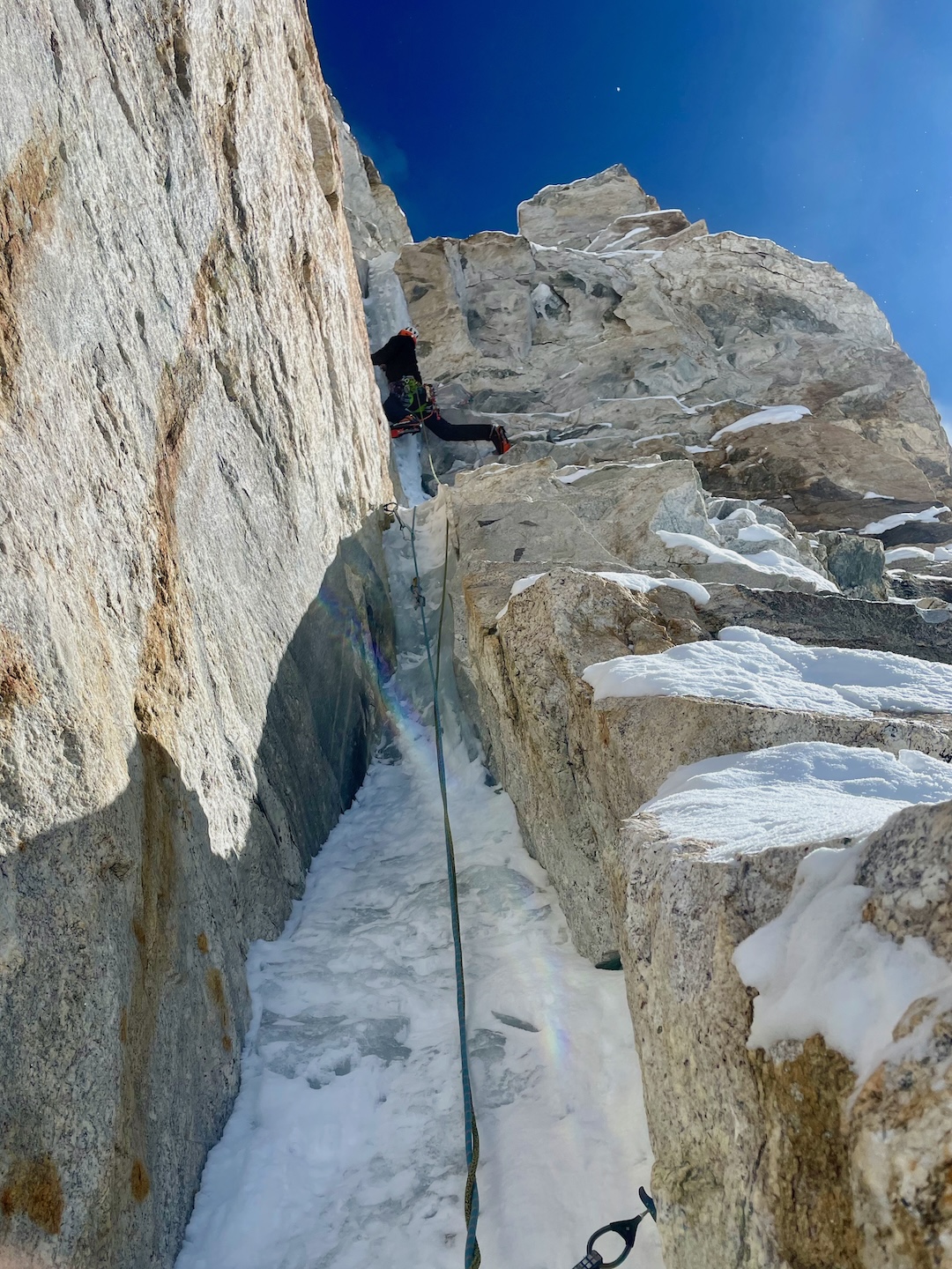 Ryan Griffiths leads an ice hose through Kaqur Kangri’s upper headwall at about 6,700 meters on the southwest arête. The eight mixed pitches of the headwall took two days to climb. 