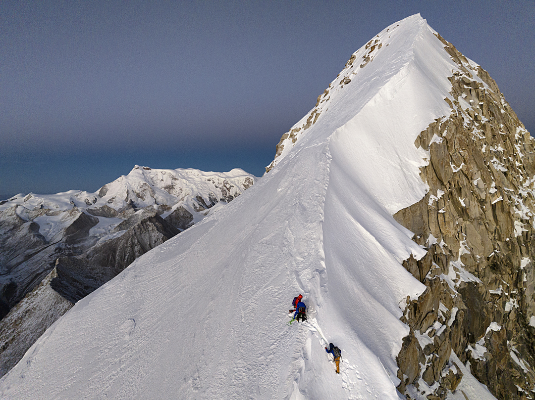 Heading toward the west shoulder of Sir Duk late in the day in November 2024, with the southwest flank of the Nyachen Tanglha peaks in the background (main summit on the left). 