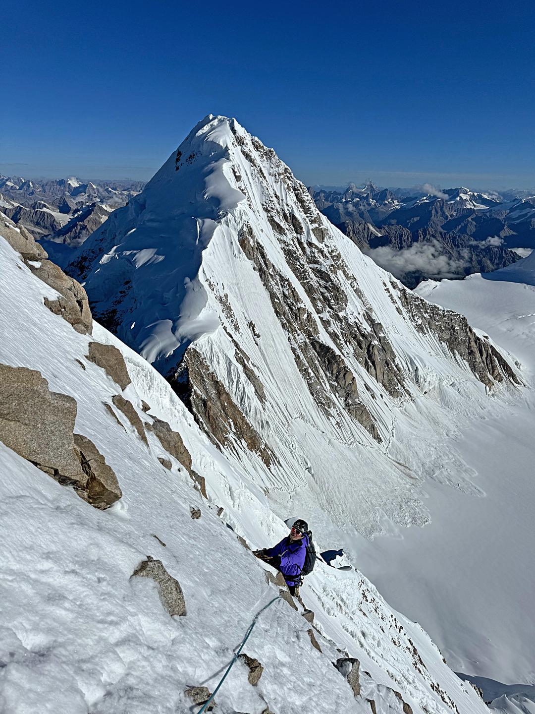 Wang Yongpeng on the upper northeast face of Chuchepo with unclimbed Sendho (6,252m) behind. 