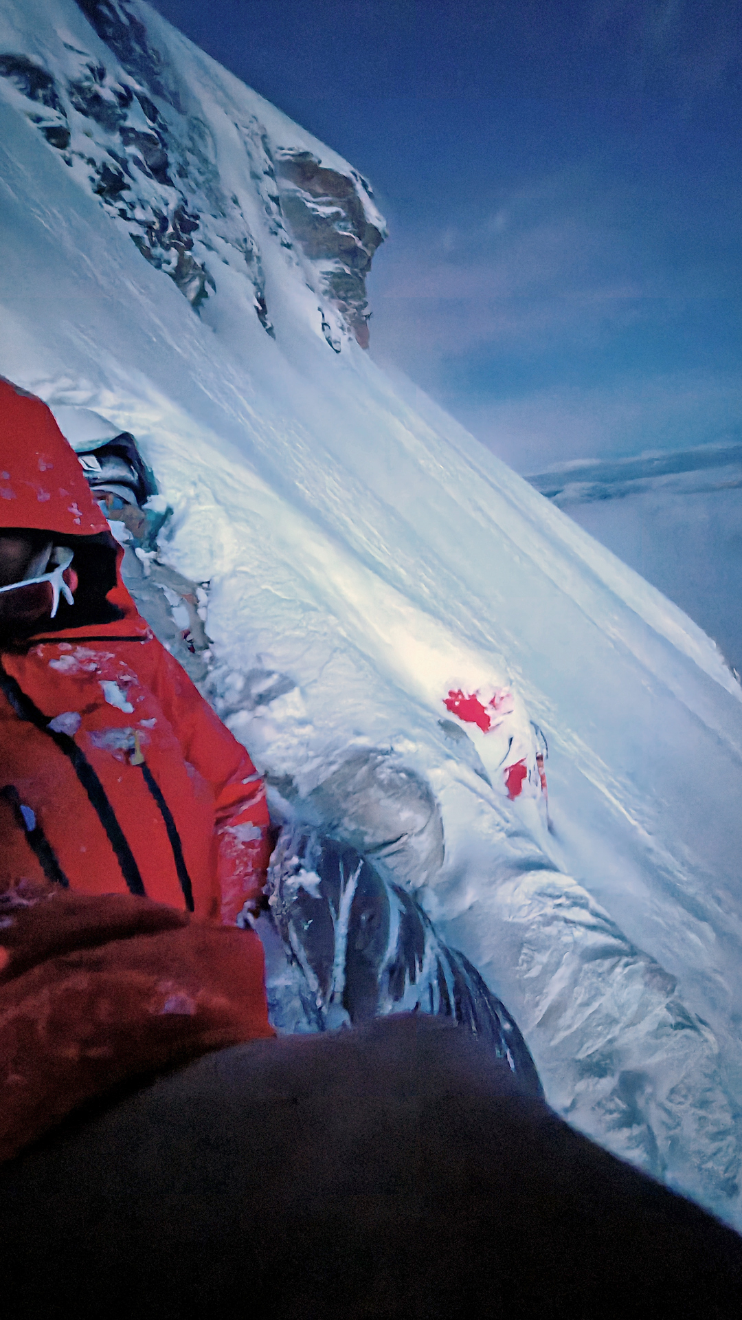 The first bivouac on the north spur of Chomolhari III, with the climbers buried by drifting snow. 