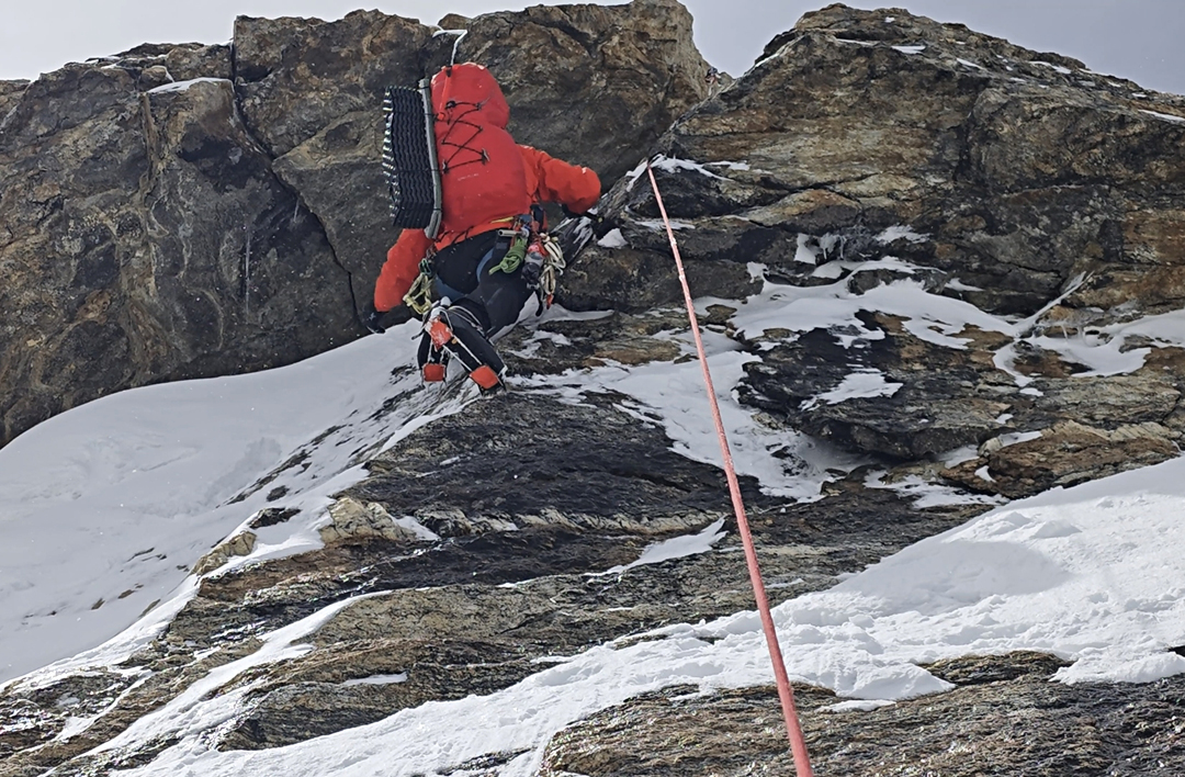 Difficult mixed climbing at the start of the second rock band on the north spur of Chomolhari III. 