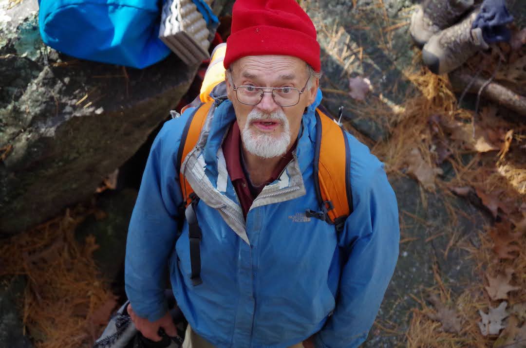 Pete Cleveland looksup from the base of the crag at Stienke Basin, Devil's Lake State Park, Baraboo, Wisconsin, October 2016.  