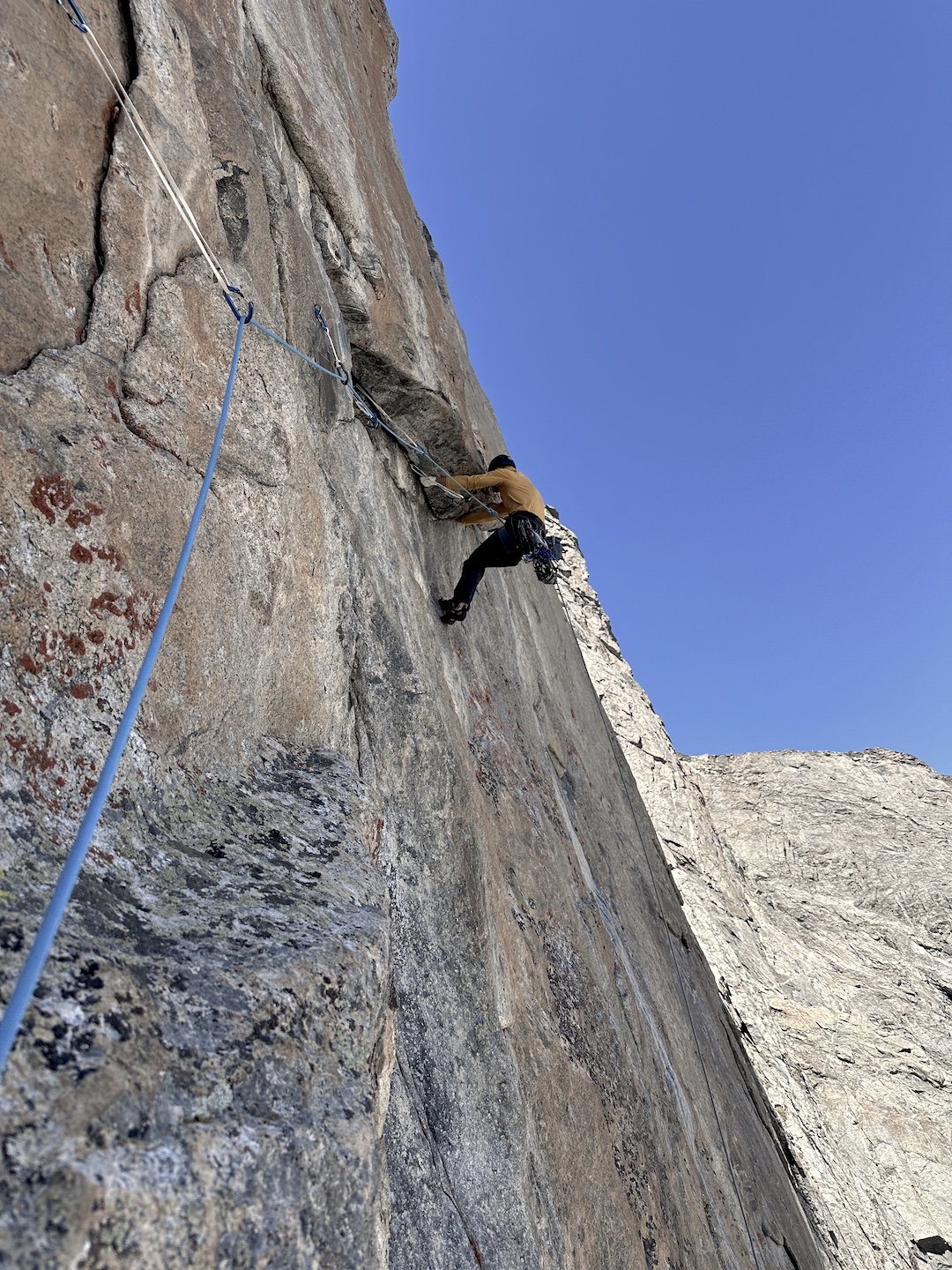 Louis Aden on the 5.12 fourth pitch of Crowheart on the northeast face of Roberts Mountain.