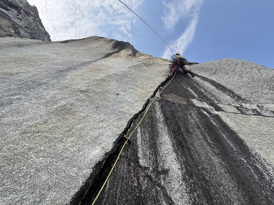 Balin Miller leading a 5.11b pitch on a route attempted during the 2025 Nenana Mountain trip. 