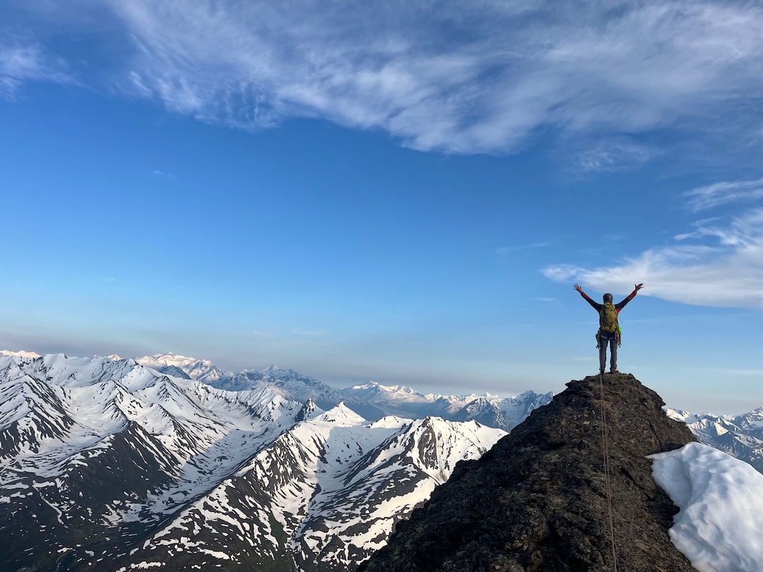 Travis Powell on the summit of Little Podju (6,340’) after making the first known ascent of the mountain. The next day the team would climb two peaks along a ridge to the north, Big Ramp and a 6,650-foot peak that they named McAlpine Peak in honor of a lost friend.
