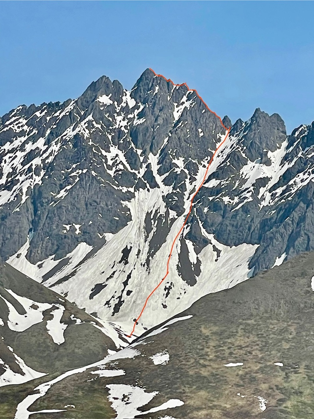 The line of the first ascent of Little Podju (6,340’), as seen from the west. The day after climbing Little Podju the team would climb snow to the north of the peak, and then turn northwest toward Big Ramp and McAlpine Peak. 