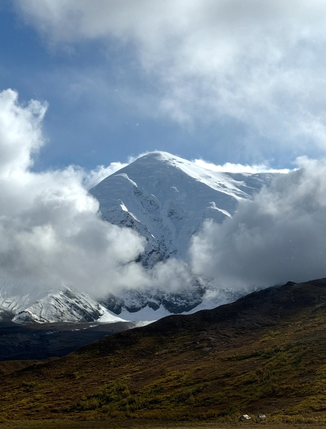 The northwest face of Peak A-112 from the approach. The north ridge, climbed in 2025, is the left skyline.
