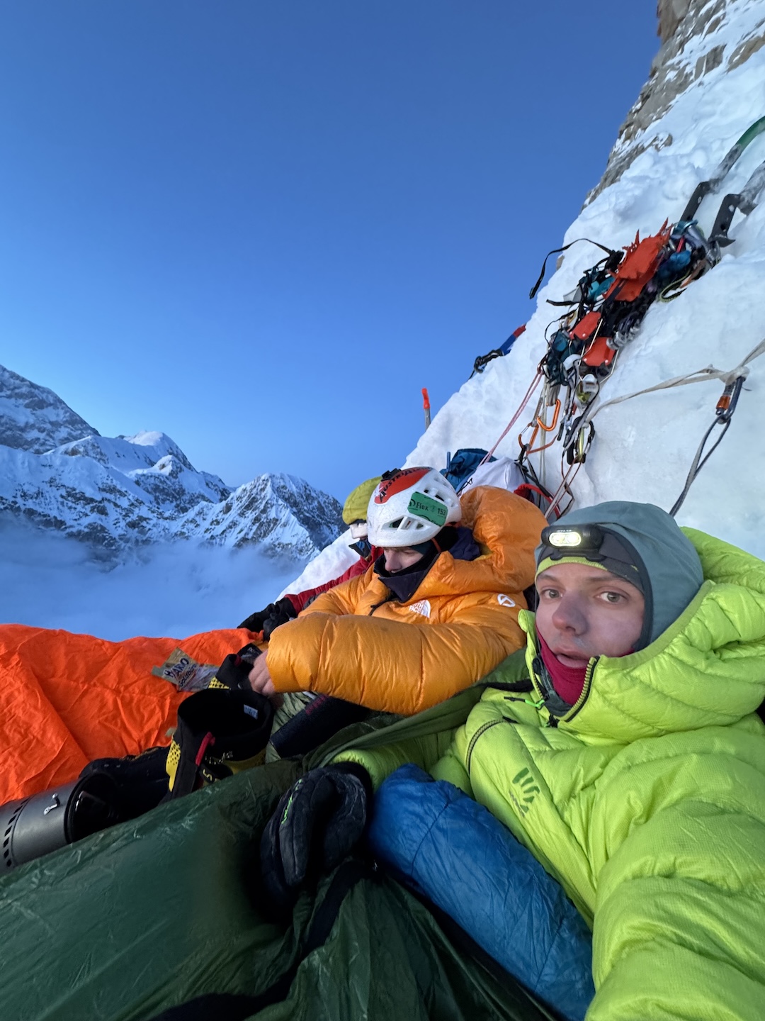 Balin Miller, David Hechl, and Vincent Landry (left to right) tuck into a bivy at the third ice band while attempting Deprivation on Begguya’s North Buttress. The team would descend from the bivy in the morning, but Landry and Miller returned to complete the route a couple weeks later. Miller would go on to solo the North Buttress via the French Route. 