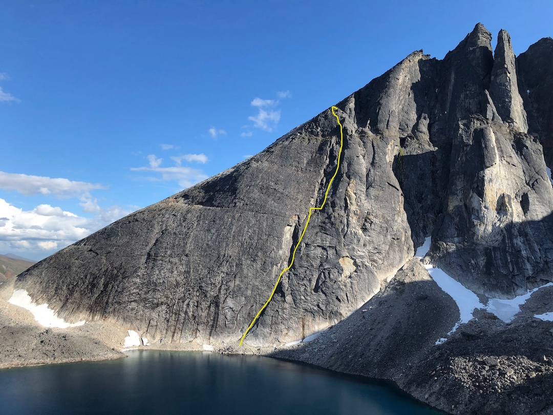 The Mosquito Pass Wall with the line of Unikkiga Akłunaaq (260m, 5.8). The first ascent of the wall was via a snow and ice couloir about as far right of the prominent pinnacles as Unikkiga Akłunaaq is left. 