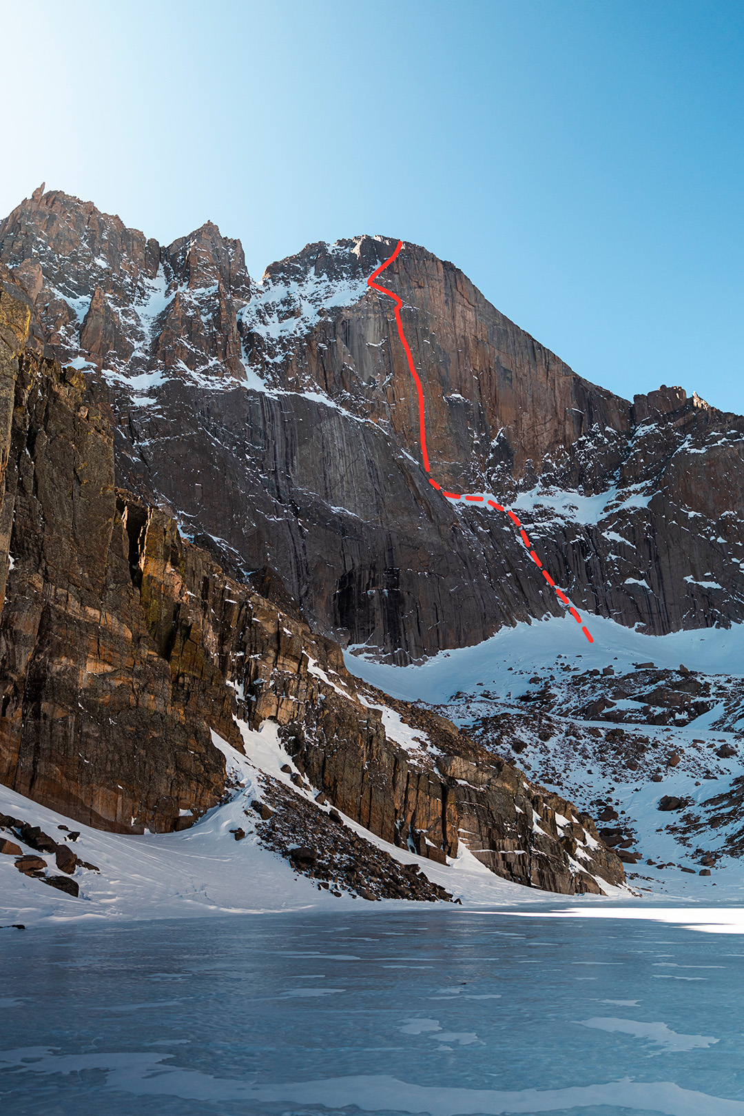 The Diamond on Longs Peak (14,259'), seen from Chasm Lake. The dashed line shows the North Chimney approach to Broadway ledge. The solid line is the approximate route of D7.