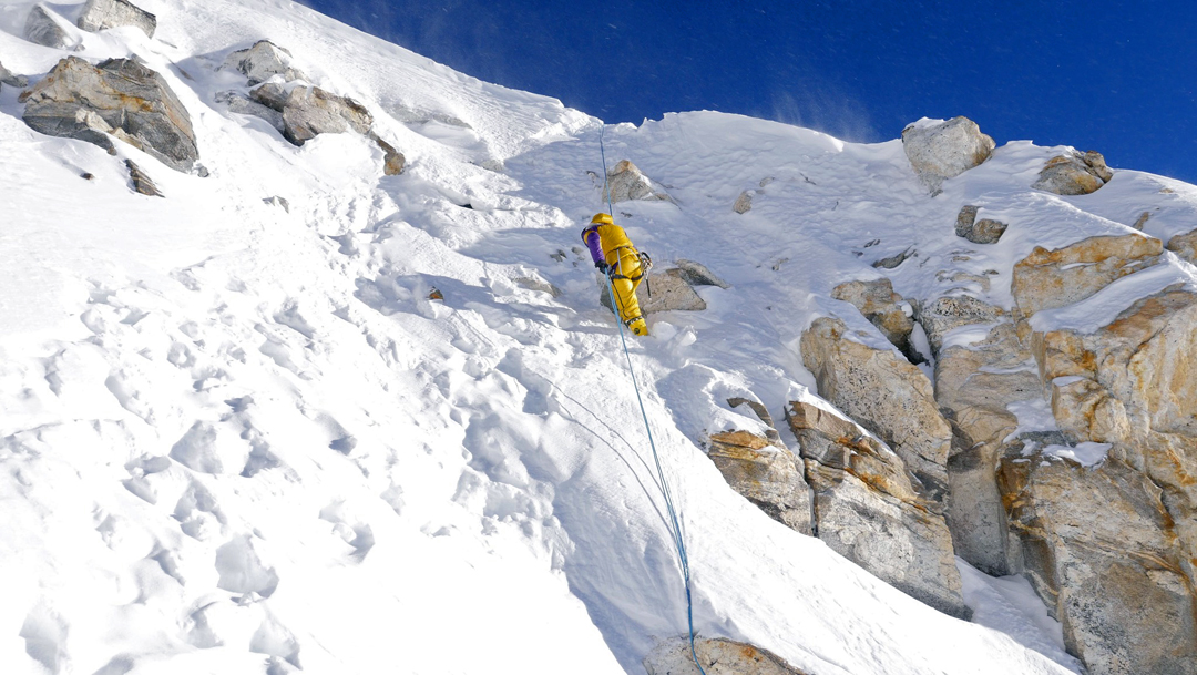 Nives Meroi making the one rappel needed on the descent from Kabru, not far below the summit ridge. 