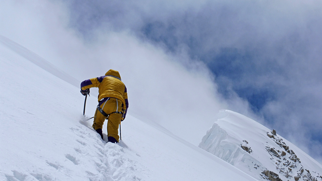 Ramono Benet heading toward the summit along the corniced north ridge of Kabru. 