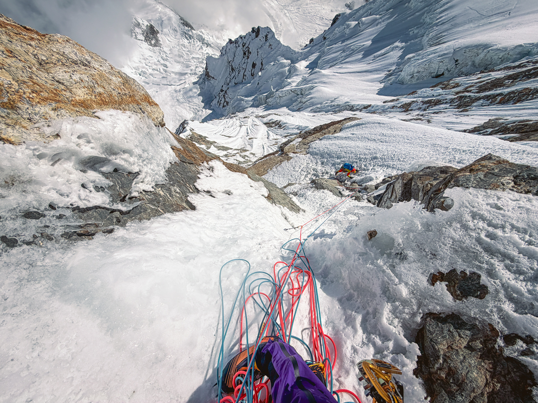 Adam Bielecki in the middle of the southeast face of Numbur, with the upper Dudh Kund Glacier far below.  