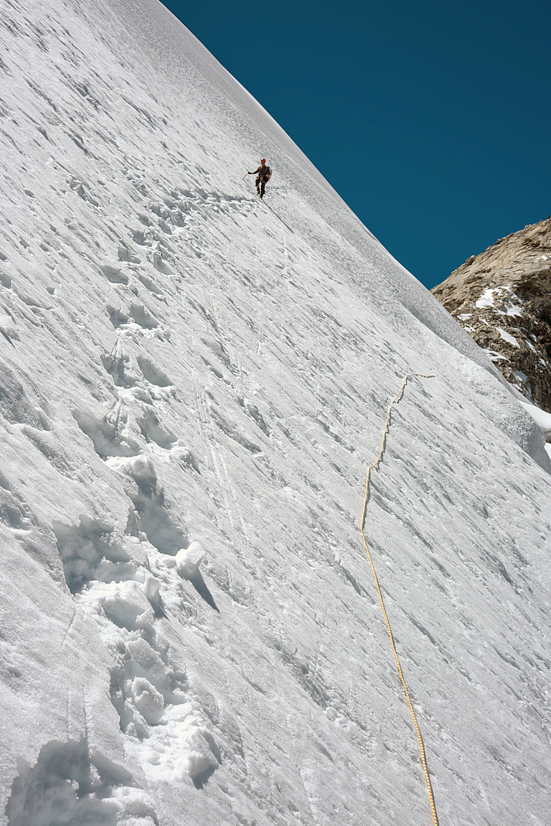 Descending the lower-angled section of the traverse across the north face, just above a region of seracs, after a successful ascent of Sumna Himal. 