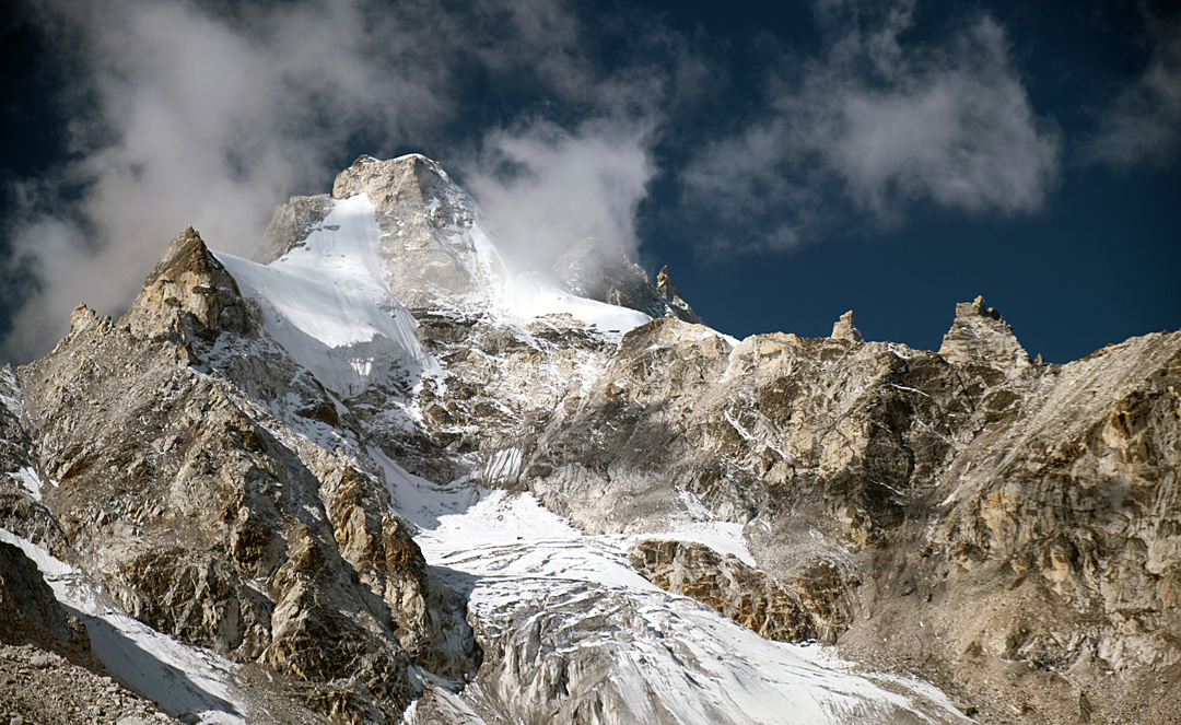 Sumna Himal (6,084m) seen from the east, near to high camp. The snowy north face is just visible through cloud on the right. 